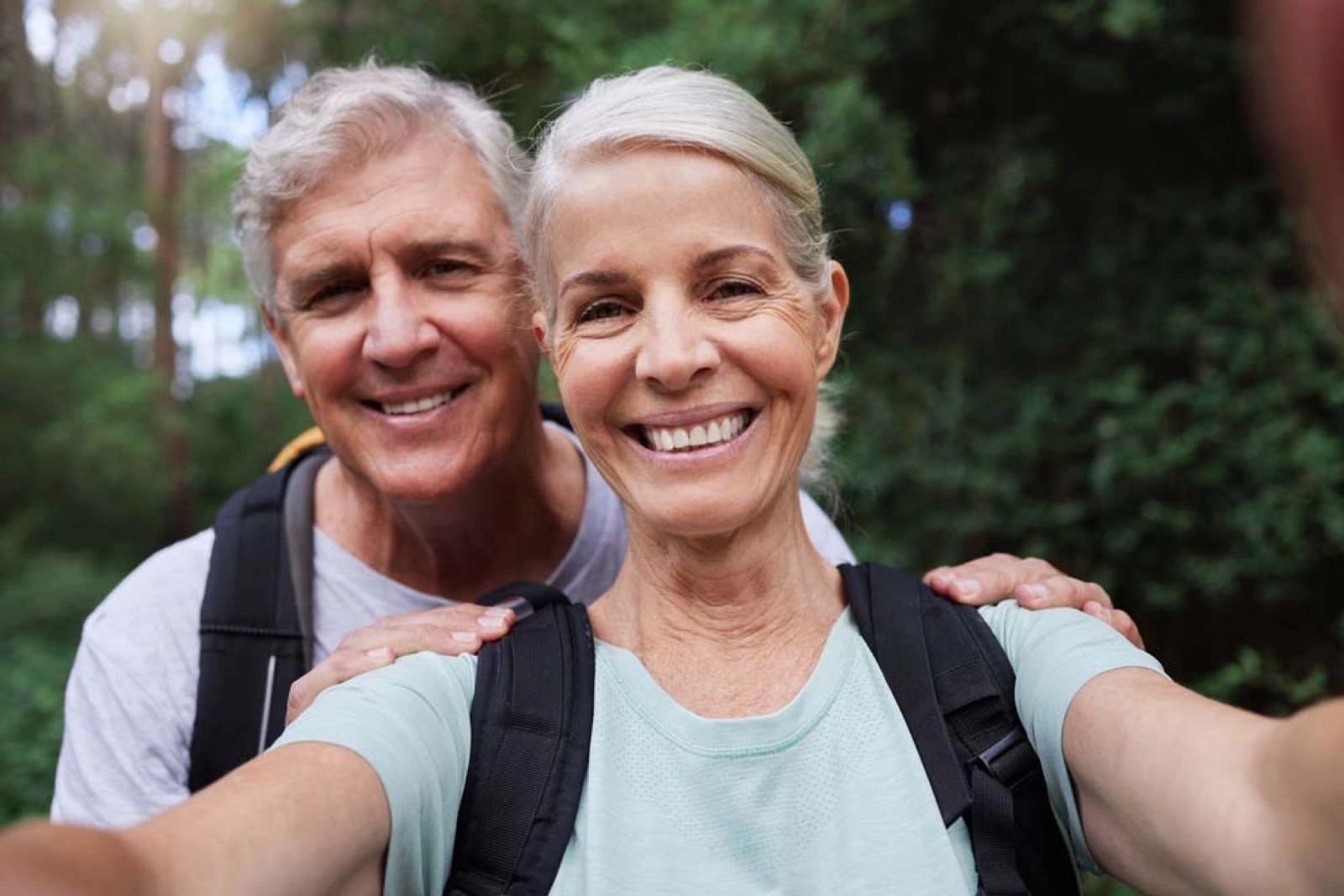 Active older couple smiling together